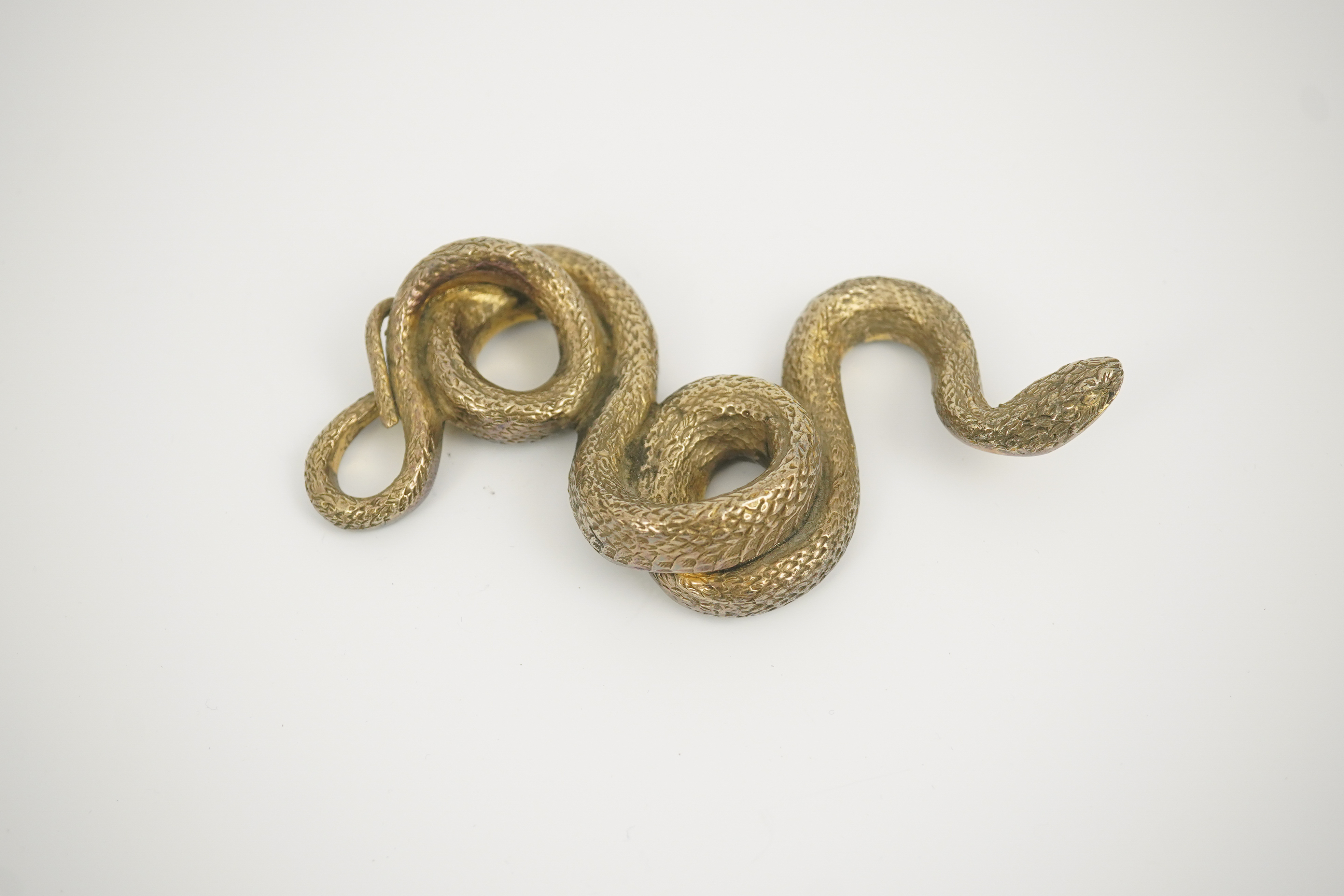 A Sterling silver gilt model of a snake, stamped PR.S